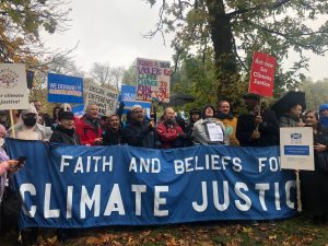 Members of different faiths protesting together at the Day of Action for Climate Justice