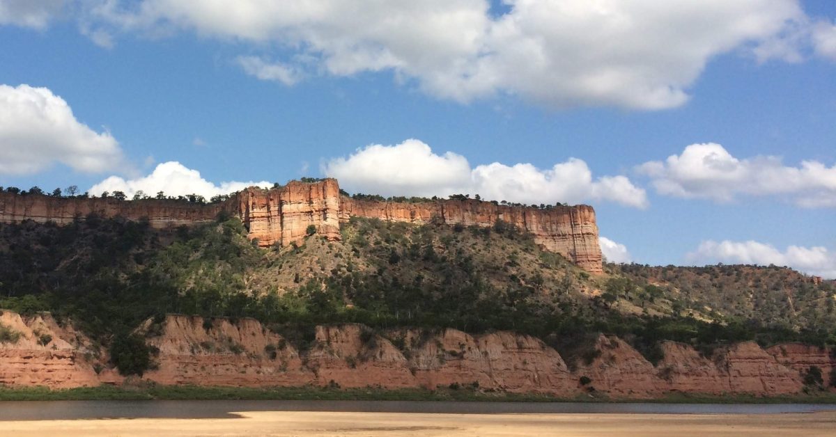 The red cliffs and river of Gonarezhou (the place of the elephants) in South-East Zimbabwe.