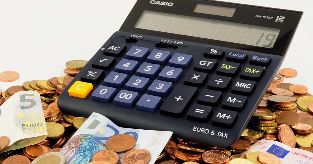 Image of a calculator and coins