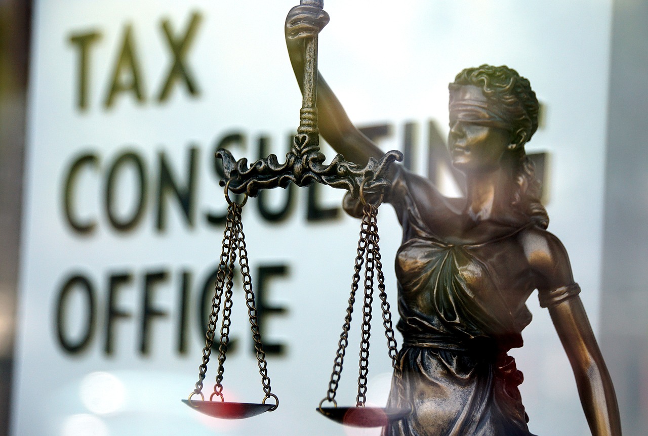 Image of a tax consultant office, with a statue of lady justice outside