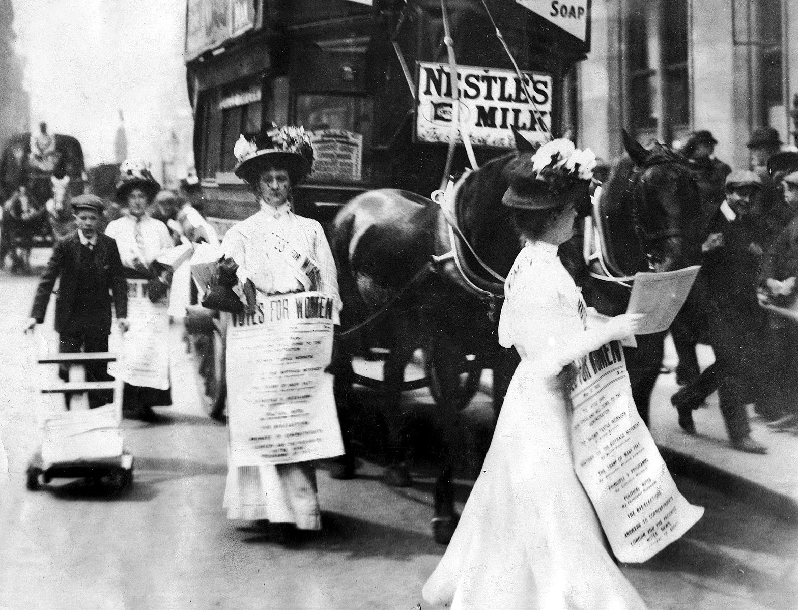 Photo courtesy of FLIKR Suffragettes protesting on the street.