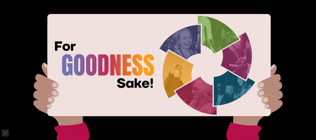 This is a banner with the For Goodness Sake Conference Logo on it held by a pair of hands as if it were a protest sign. The logo is a wheel of coloured segments.